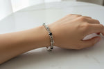 Laden Sie das Bild in den Galerie-Viewer, 18K Weißgold Armband mit Diamanten und Saphiren
